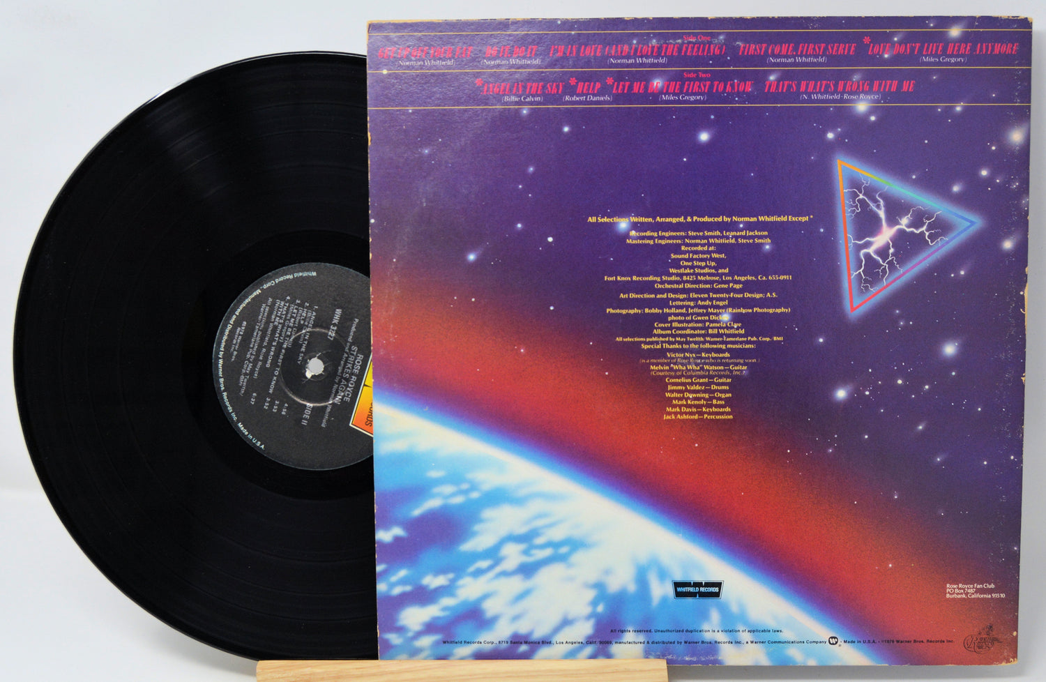 Vinyl record with a colorful album cover featuring space-themed design