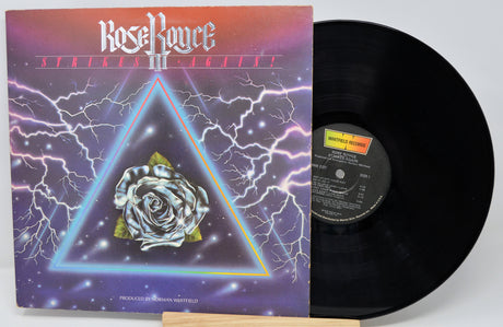 Vinyl record with cover featuring a rose and triangle design on a white background