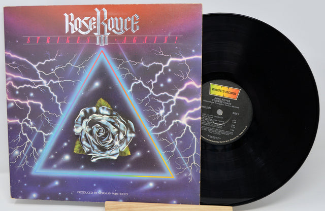 Vinyl record with cover featuring a rose and triangle design on a white background