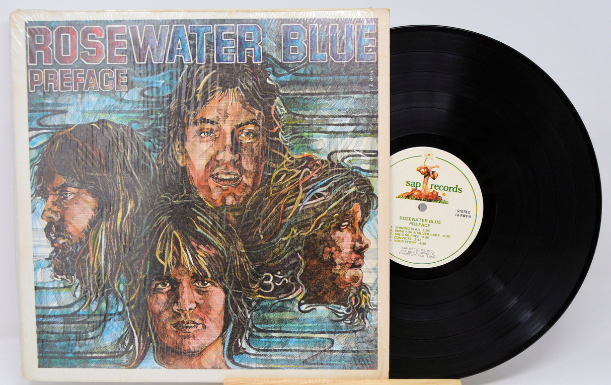 Front cover and vinyl record of Rosewater Blue Preface LP featuring colorful band portrait artwork and SAP Records label