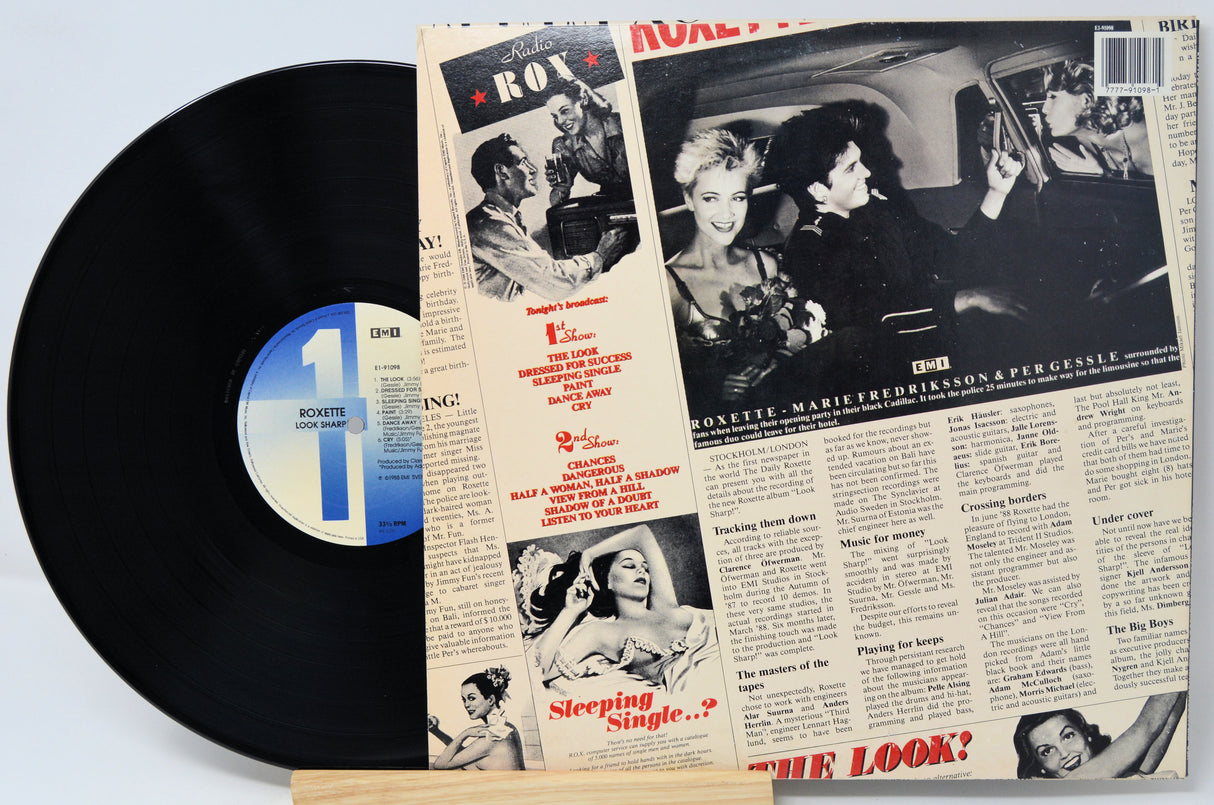 Vinyl record with a cover featuring black and white images and text.
