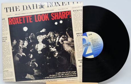 Vinyl record with 'Roxette Look Sharp!' album cover on a light blue background