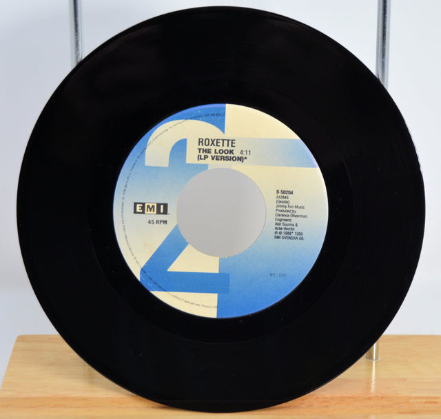 Roxette 'The Look' Vinyl record with a blue and white label on a wooden surface