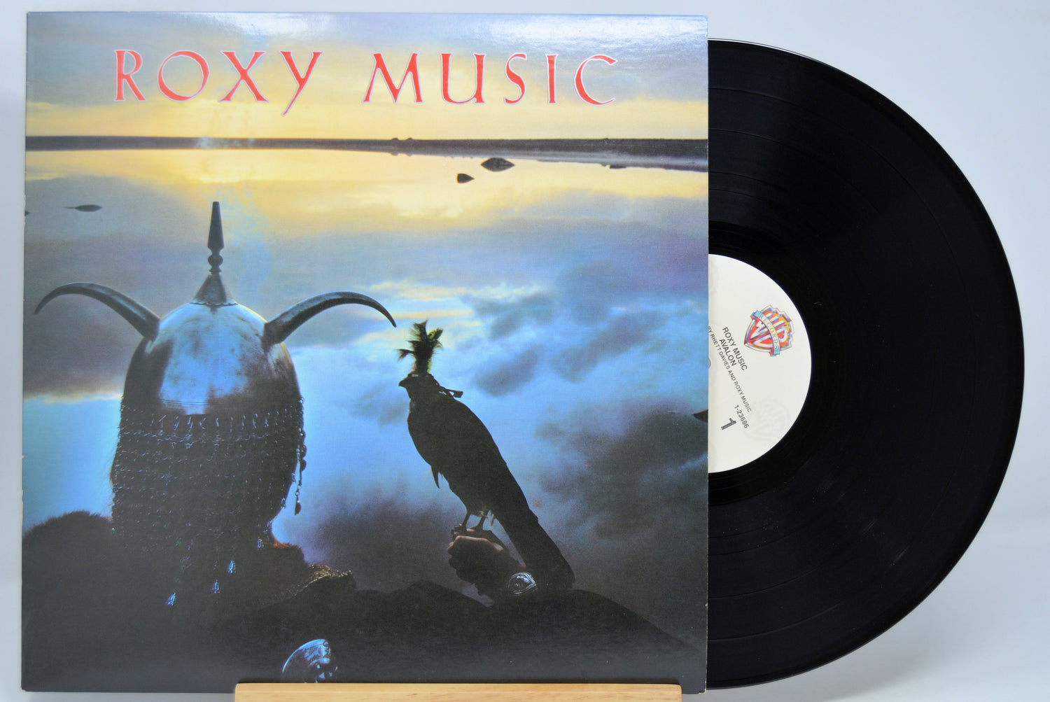 Vinyl record with a cover featuring Roxy Music - Avalon  and a silhouette of a person and bird.