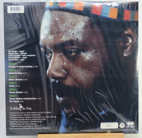 Back cover of a vinyl record sleeve for Roy Brooks' 'Understanding' on Columbia Records, featuring a close-up portrait of the artist with track listing text on the left and a striped multicolor headband at the top.