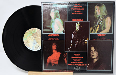 Vinyl record with a colorful cover featuring images of a person and text.