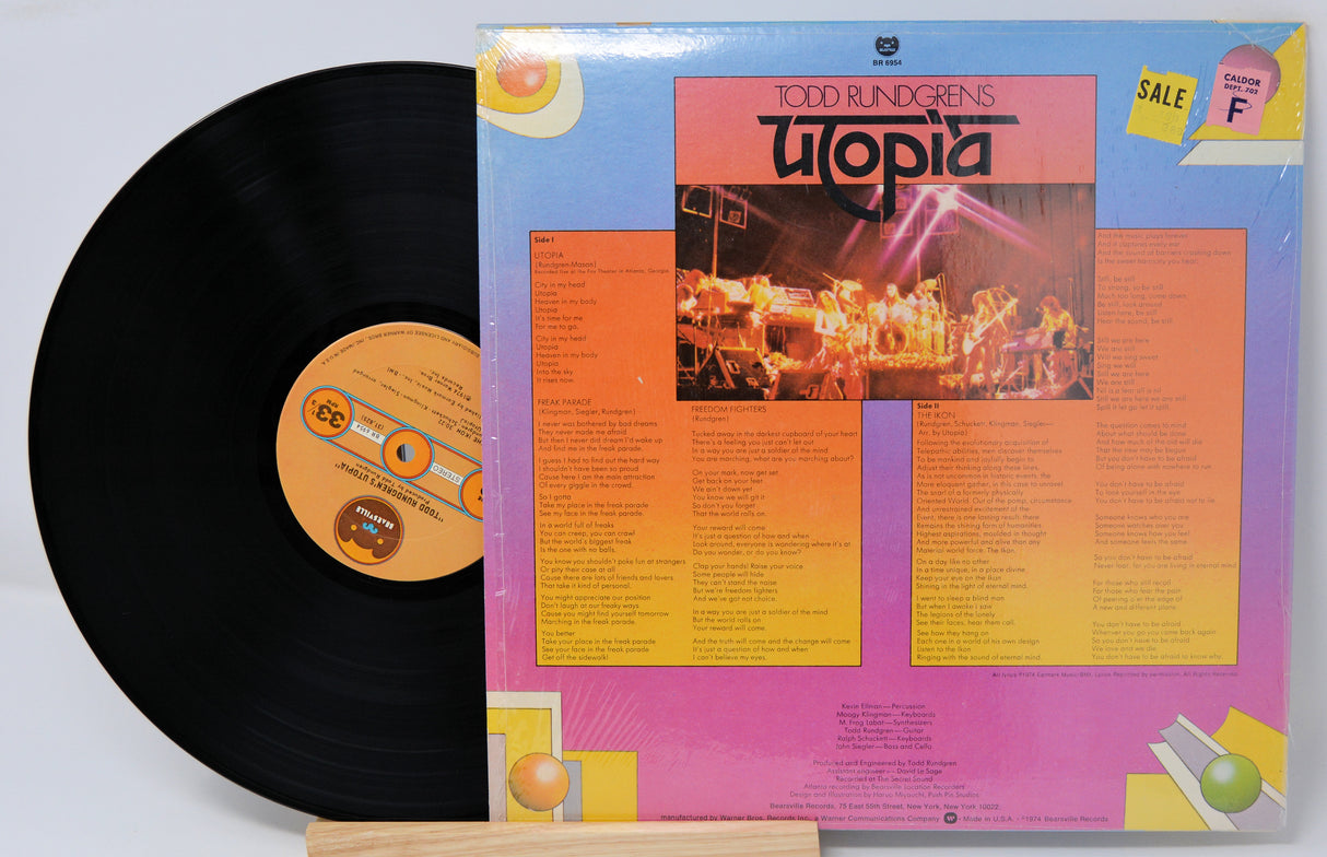 Vinyl record by Todd Rudgren titled Utopia showing the album and back cover which has a picture of the band and song listing in text.