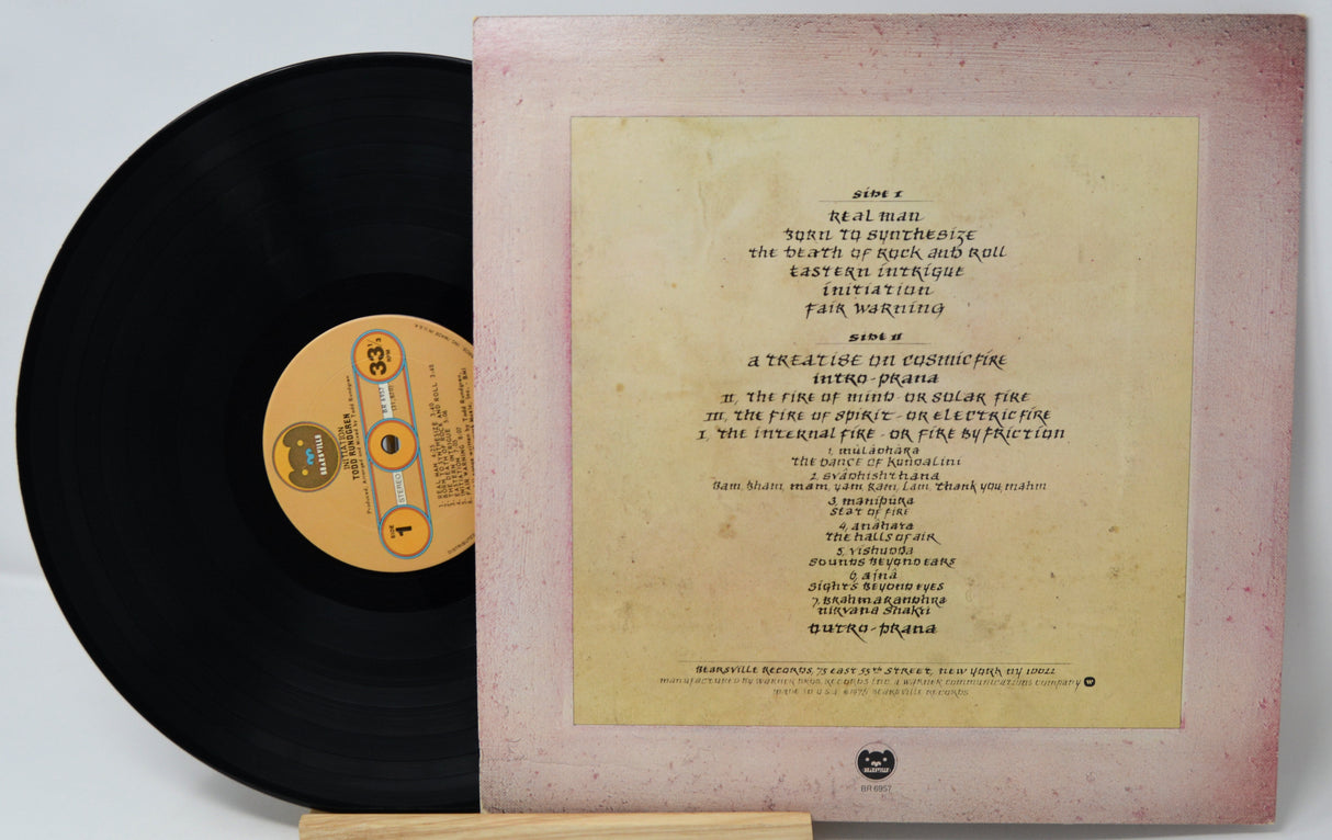 Vinyl record with a yellowed cover displaying text