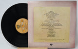 Vinyl record with a yellowed cover displaying text