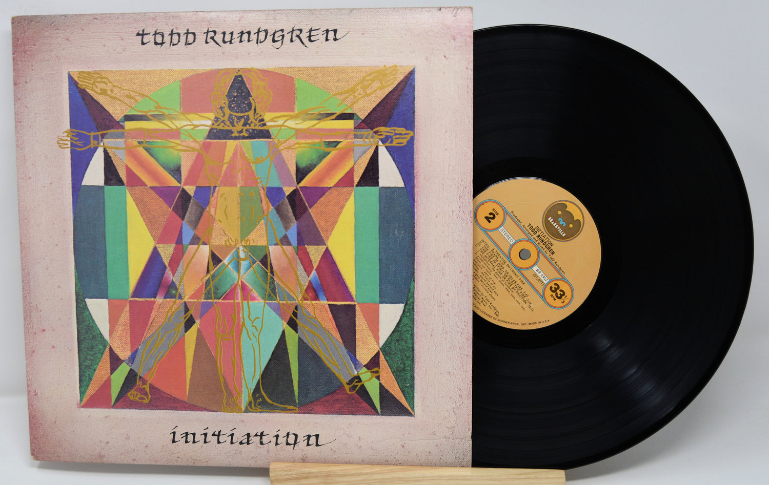 Vinyl record with a colorful cover featuring geometric designs and the title 'Initiation' by Todd Rundgren.