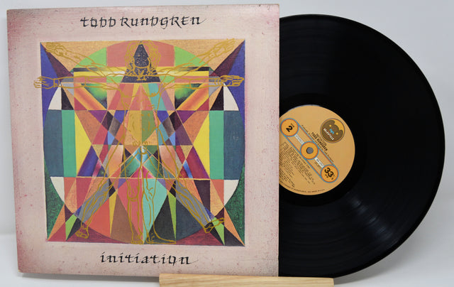 Vinyl record with a colorful cover featuring geometric designs and the title 'Initiation' by Todd Rundgren.