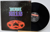 Vinyl record with 'Rush 2112' cover featuring a star design on a black background.