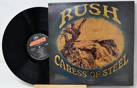 Vinyl record and cover of 'Caress of Steel' by Rush on a white background
