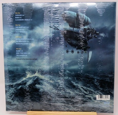 Vinyl record album back cover for 'The Anchorman' album by Nick Waterman and Rush, wrapped in clear plastic with visible reflections, displayed on a wooden stand.