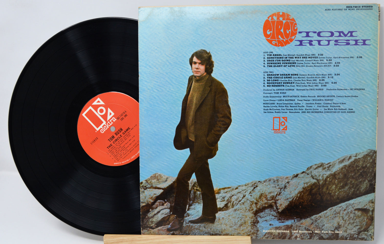 Vinyl record with cover featuring a person walking on rocks
