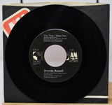 Vinyl record with label on a white background