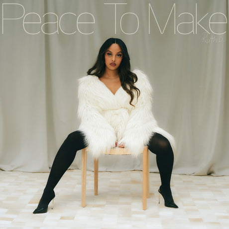 Person wearing a white fur coat sitting on a chair with text overlay