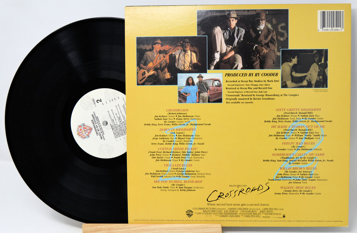 Vinyl record with yellow label featuring album cover and text