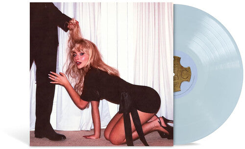 Blue vinyl record with a cover featuring a woman on all fours and a man's leg, against a white curtain background.
