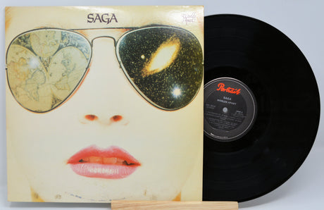 Vinyl record with a stylized album cover featuring sunglasses and a face.