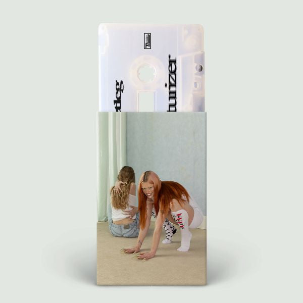 Sagittarius Moisturizer cassette tape with unique cover art featuring two women in white outfits, one crouching and smiling