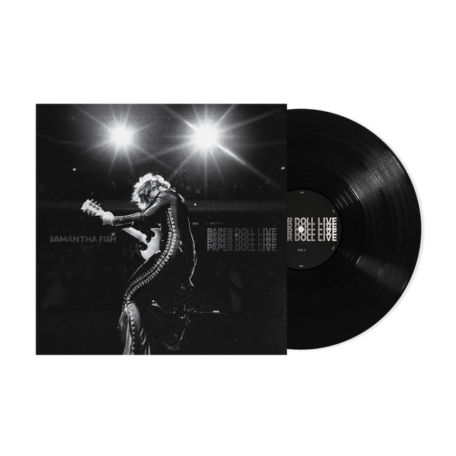 Vinyl record with a black and white photo of a performer on the cover