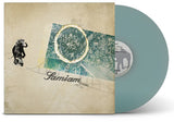 Vinyl record with a stylized cover featuring an elephant and abstract design, on a white background.