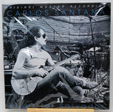 Carlos Santana 'Blues for Salvador' original master recording vinyl LP cover, featuring a black and white photo of Santana playing guitar in a studio setting.