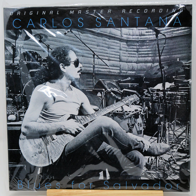 Carlos Santana 'Blues for Salvador' original master recording vinyl LP cover, featuring a black and white photo of Santana playing guitar in a studio setting.