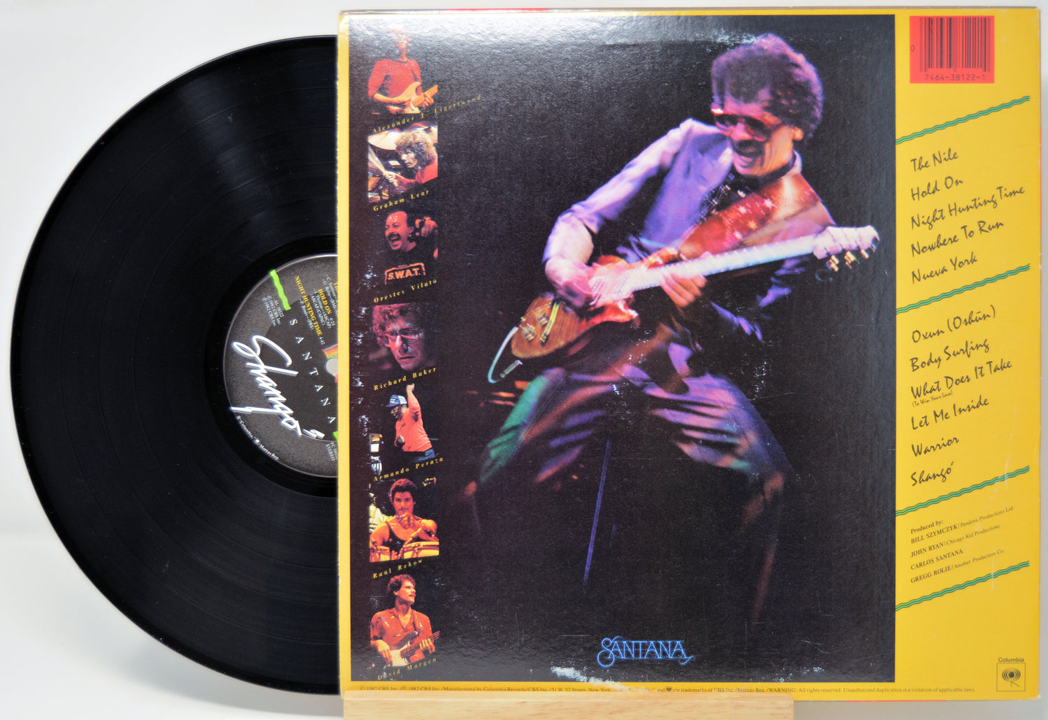'Santana Shango' Vinyl record with a colorful cover featuring a guitarist, on a white background.