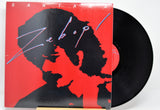 Vinyl record with a red cover featuring a black silhouette and the word 'Santana' titled 'Zebop!'.