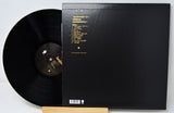 Back cover of Sarabeth Tucek vinyl record with tracklist in gold text