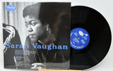 Sarah Vaughan vinyl record album with the cover in front and the black LP record partially visible behind it on a light gray background.