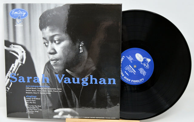 Sarah Vaughan vinyl record album with the cover in front and the black LP record partially visible behind it on a light gray background.