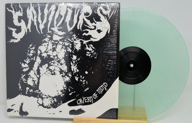 Front cover and mint green vinyl of Saviours Cavern of Mind LP featuring bold rock art