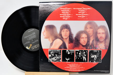 Vinyl record with cover featuring a band's portrait and album tracklist on a white background