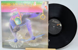 Vinyl record with colorful cover featuring a space-themed illustration on a white background