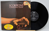 Vinyl record with 'Scorpions Lonesome Crow' album cover showing a hand holding a scorpion.