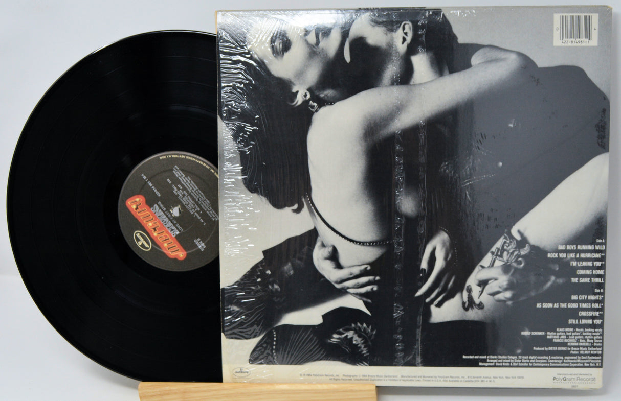 Vinyl record with a black and white cover featuring an intimate pose.