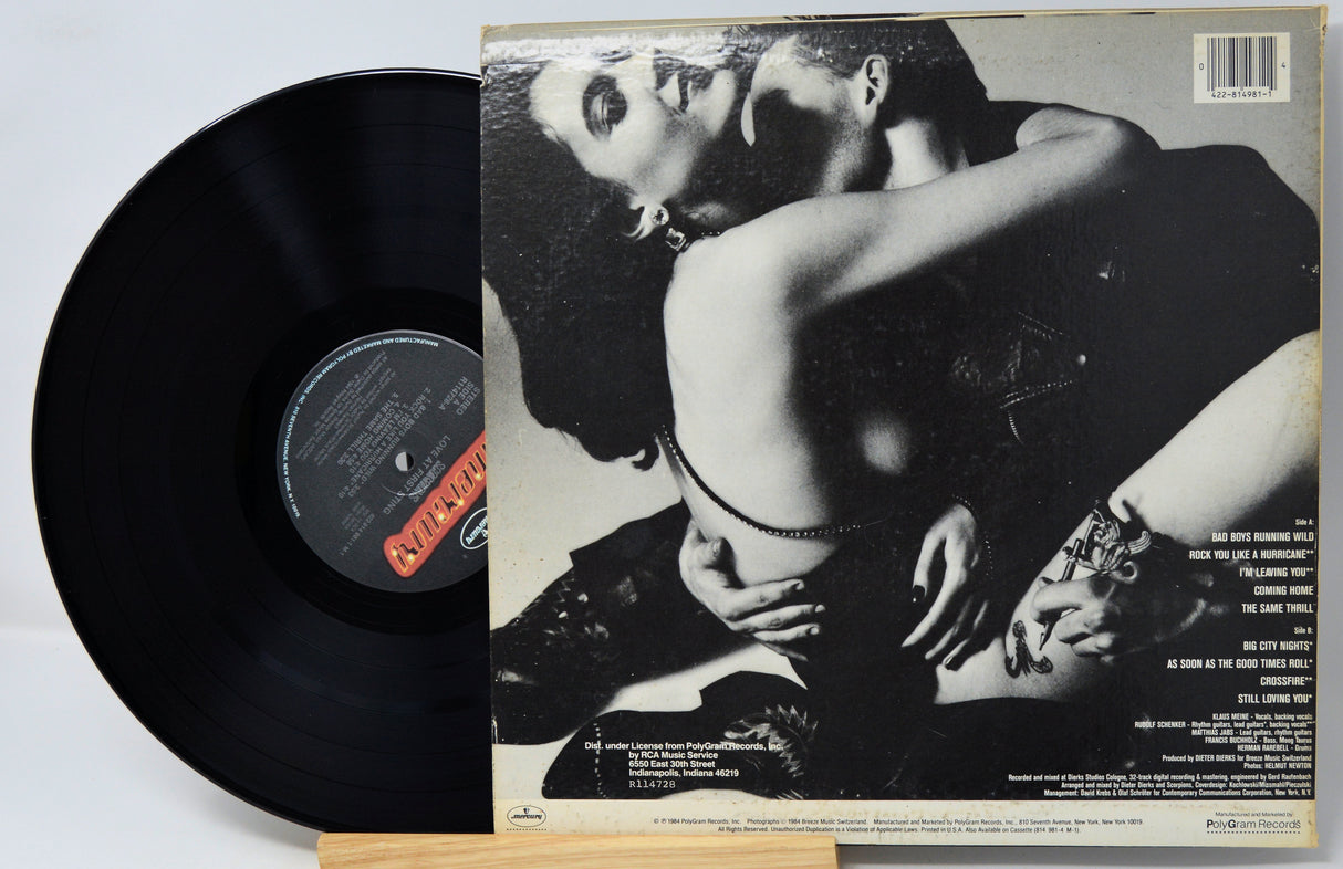 Vinyl record with a cover featuring a black and white image of two people embracing.