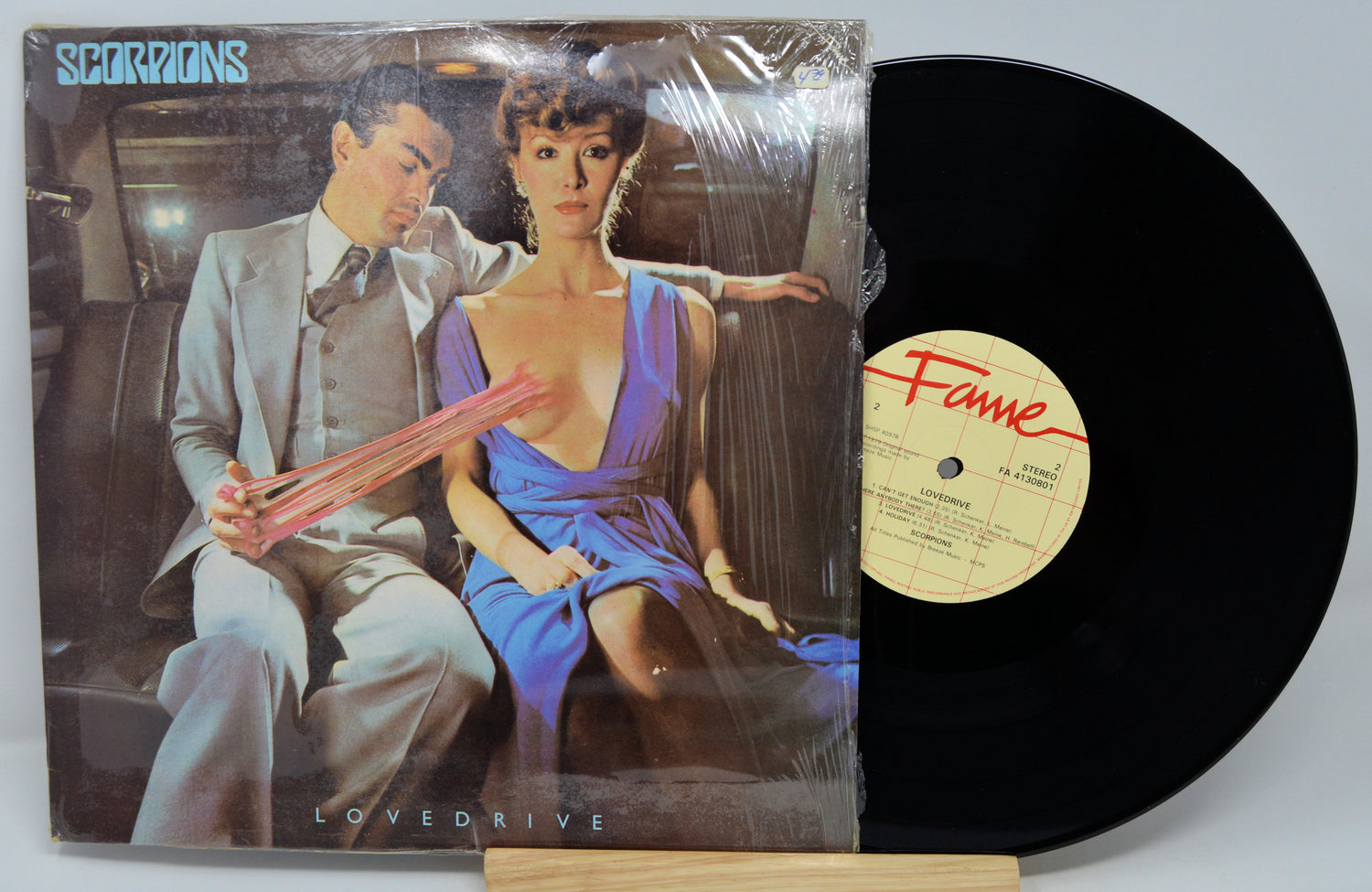 Vinyl record with cover featuring a couple and 'Fame' label