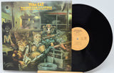 Vinyl record with cover featuring cartoon animals playing instruments inside a car.