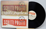 Vinyl record with 'Scritti Politti' album cover featuring red and beige design.