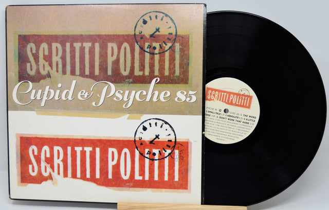 Vinyl record with 'Scritti Politti' album cover featuring red and beige design.