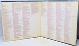 Open book with text on a white background