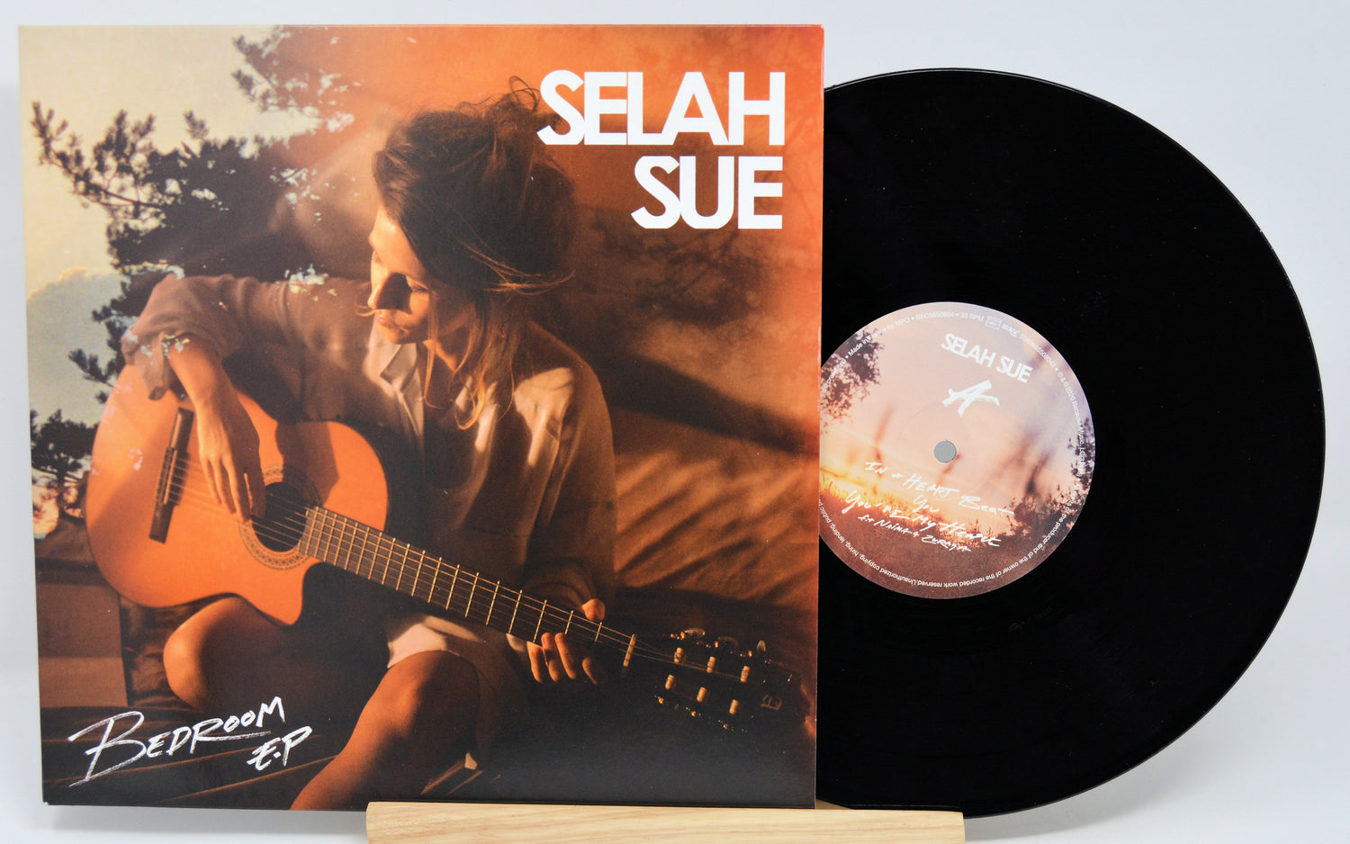 Vinyl record with cover featuring a person playing guitar, labeled 'Selah Sue'.