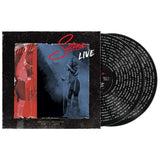 Vinyl record with 'Setena Live' cover featuring a performer on stage.