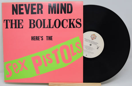 Vinyl record with pink cover featuring 'Never Mind the Bollocks' by the Sex Pistols.