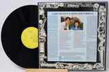 Vinyl record with a detailed cover featuring text and images of two people.
