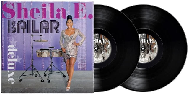 Vinyl records with a cover featuring a woman and musical instruments on a purple background.